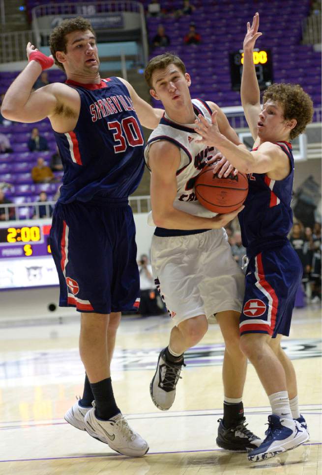 Leah Hogsten  |  The Salt Lake Tribune
Springville's Andrew Slack and Benntt Hullinger pressure Woods Cross' Trevin Knell. Springville High School defeated Woods Cross High School 51-50 at the buzzer during their 4A State boys' basketball quarterfinal playoff game at Weber State University's Dee Events Center, Thursday, March 2, 2017.