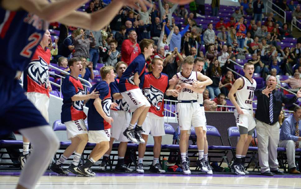 Leah Hogsten  |  The Salt Lake Tribune
Woods Cross celebrates a tie game that forced the game into overtime. Springville High School defeated Woods Cross High School 51-50 at the buzzer during their 4A State boys' basketball quarterfinal playoff game at Weber State University's Dee Events Center, Thursday, March 2, 2017.