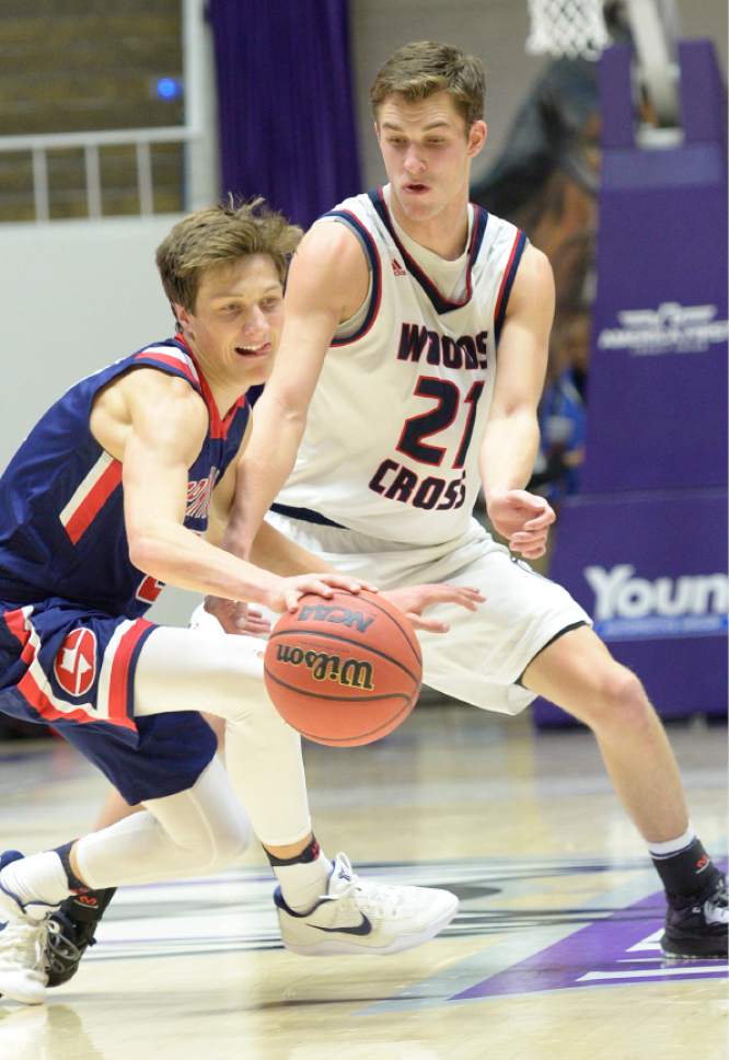 Leah Hogsten  |  The Salt Lake Tribune
Woods Cross' Trevin Knell tries to steal from Springville's Seth Mortensen. Springville High School defeated Woods Cross High School 51-50 at the buzzer during their 4A State boys' basketball quarterfinal playoff game at Weber State University's Dee Events Center, Thursday, March 2, 2017.