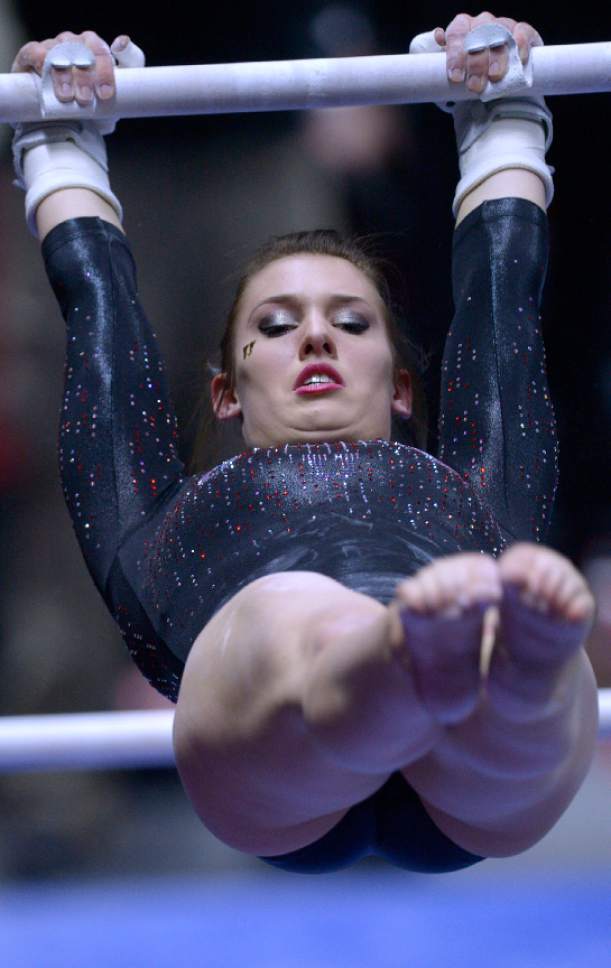 Leah Hogsten  |  The Salt Lake Tribune
Utah's Baely Rowe was best on the uneven parallel bars with a score of 9.950. University of Utah No. 6 gymnasts defeated  No. 11 Oregon State 196.125 to 195.125 during their Pac-12 meet in Salt Lake City, January 23, 2016.