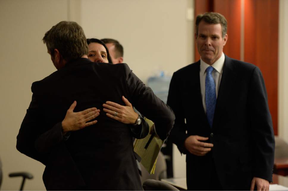 Francisco Kjolseth | The Salt Lake Tribune
Defense attorney's Cara Tangaro and Scott C. Williams embrace as former Utah Attorney General John Swallow right, had just found out he was cleared of all charges during his public-corruption trial in Salt Lake City, Thursday March 2, 2017.