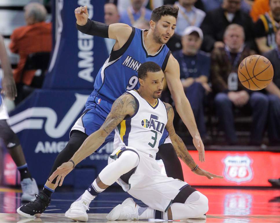 Utah Jazz guard George Hill (3) falls as Minnesota Timberwolves guard Ricky Rubio (9) defends during the first half in an NBA basketball game Wednesday, March 1, 2017, in Salt Lake City. (AP Photo/Rick Bowmer)