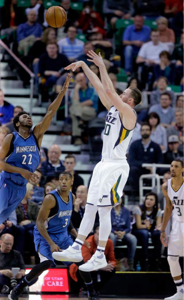 Utah Jazz forward Gordon Hayward, right, shoots as Minnesota Timberwolves forward Andrew Wiggins (22) defends during the first half in an NBA basketball game Wednesday, March 1, 2017, in Salt Lake City. (AP Photo/Rick Bowmer)