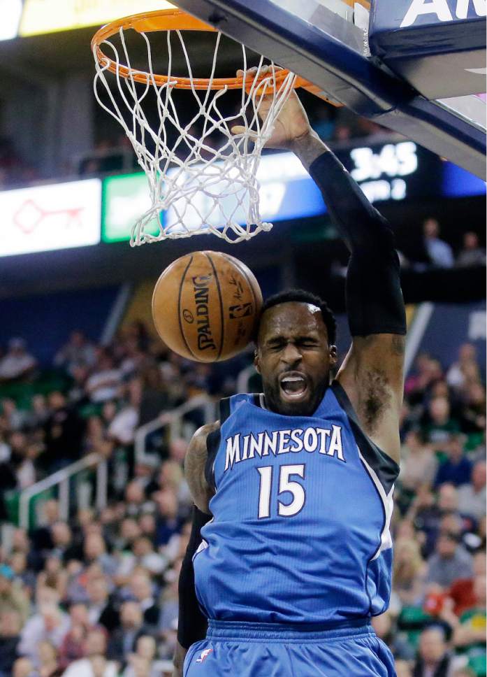Minnesota Timberwolves forward Shabazz Muhammad (15) dunks during the first half in an NBA basketball game against the Utah Jazz, Wednesday, March 1, 2017, in Salt Lake City. (AP Photo/Rick Bowmer)