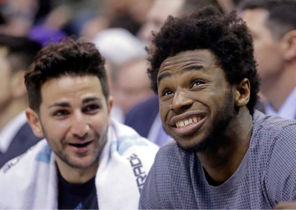 Minnesota Timberwolves' Andrew Wiggins, right, and Ricky Rubio, left, laugh together as they sit on the bench during the second half in an NBA basketball game against the Utah Jazz, Wednesday, March 1, 2017, in Salt Lake City. Timberwolves won 107-80. (AP Photo/Rick Bowmer)