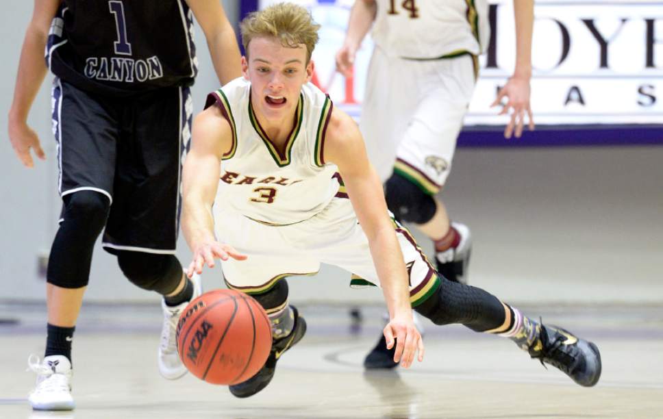 Leah Hogsten  |  The Salt Lake Tribune
Maple Mountain's Parker Christensen hits the deck for a loose ball. Corner Canyon High School defeated Maple Mountain High School 69-67 during their 4A State boys' basketball quarterfinal playoff game at Weber State University's Dee Events Center, Thursday, March 2, 2017.