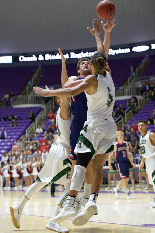 Leah Hogsten  |  The Salt Lake Tribune
Springville's center Andrew Slack (30) drives to the net around Hillcrest's forward Tyson Flores (5) Springville High School defeated Hillcrest High School 57-45 during their 4A State boys' basketball semifinal playoff game at Weber State University's Dee Events Center, Friday, March 3, 2017.