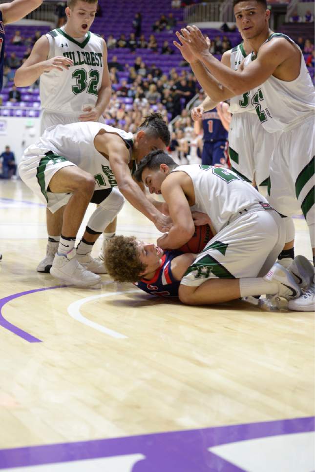 Leah Hogsten  |  The Salt Lake Tribune
Springville's Bennett Hullinger (5) hits the deck fighting Hillcrest for possession. Springville High School defeated Hillcrest High School 57-45 during their 4A State boys' basketball semifinal playoff game at Weber State University's Dee Events Center, Friday, March 3, 2017.