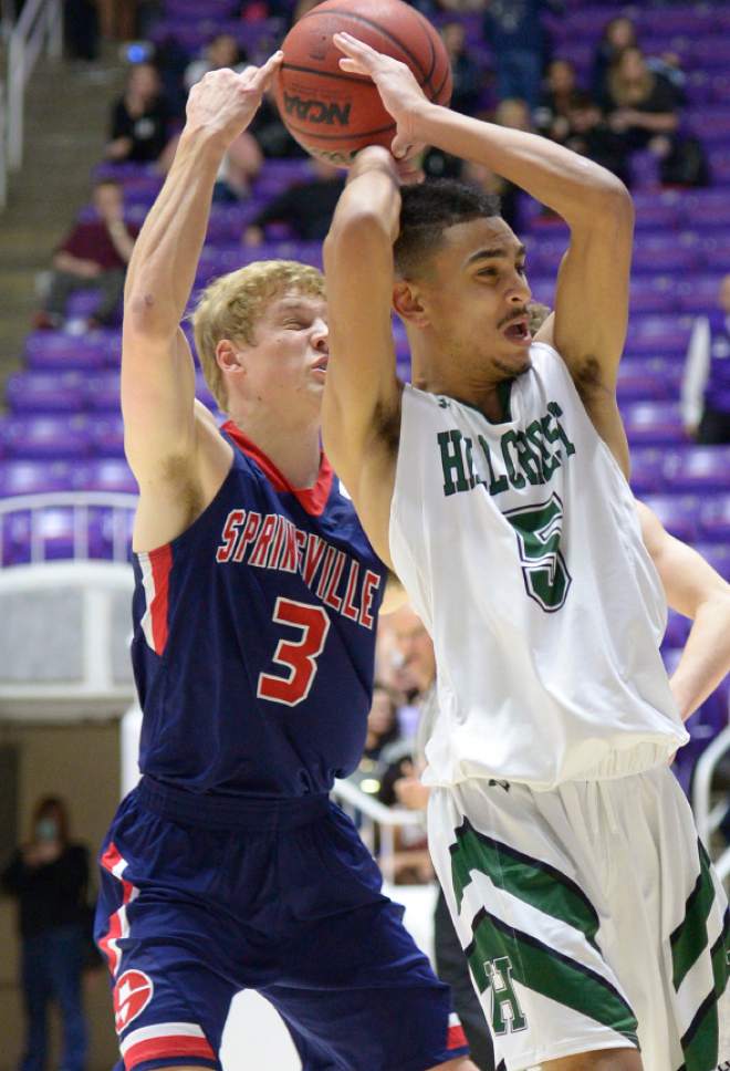 Leah Hogsten  |  The Salt Lake Tribune
Hillcrest's forward Timmy Tyms (5) gets the ball taken out of his hands from Springville's Josh Elison (3). Hillcrest High School leads Springville High School  during their 4A State boys' basketball semifinal playoff game at Weber State University's Dee Events Center, Friday, March 3, 2017.