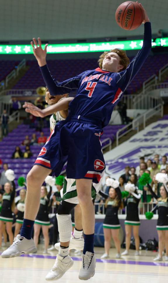 Leah Hogsten  |  The Salt Lake Tribune
Springville's Jesse Hullinger (4) pulls down the rebound over Hillcrest's forward Timmy Tyms (5). Hillcrest High School leads Springville High School  during their 4A State boys' basketball semifinal playoff game at Weber State University's Dee Events Center, Friday, March 3, 2017.