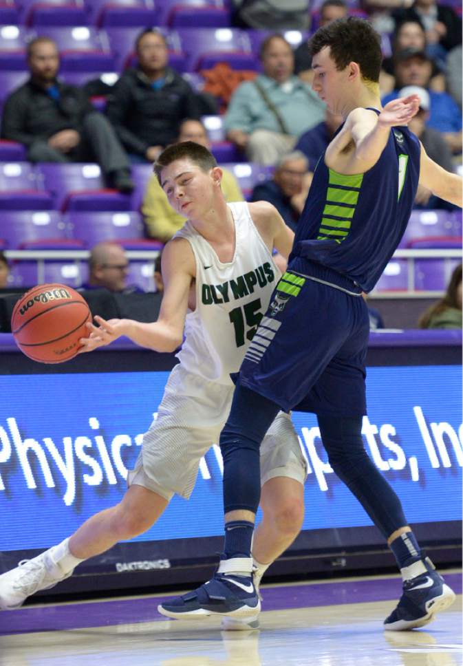 Leah Hogsten  |  The Salt Lake Tribune
Olympus' Rylan Jones is fouled by Timpanogos' Dalten Stewart. Olympus High School defeated Timpanogos High School 91-69 during their 4A State boys' basketball quarterfinal playoff game at Weber State University's Dee Events Center, Thursday, March 2, 2017.