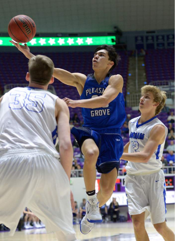 Leah Hogsten  |  The Salt Lake Tribune
Pleasant Grove's Kawika Akina shoots around Bingham's defense. Bingham High School  leads Pleasant Grove High School 19-18 during their 5A State boys' basketball semifinal playoff game at Weber State University's Dee Events Center, Friday, March 3, 2017.