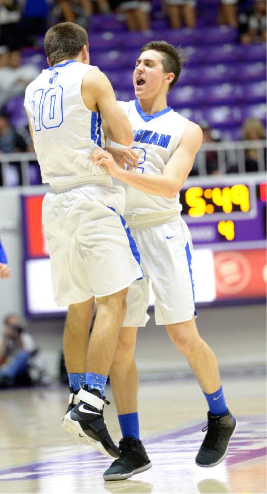 Leah Hogsten  |  The Salt Lake Tribune
Bingham's Lleyton Parker and Tanner Davis celebrate the win. Bingham High School defeated Pleasant Grove High School 54-44 during their 5A State boysí basketball semifinal playoff game at Weber State University's Dee Events Center, Friday, March 3, 2017.