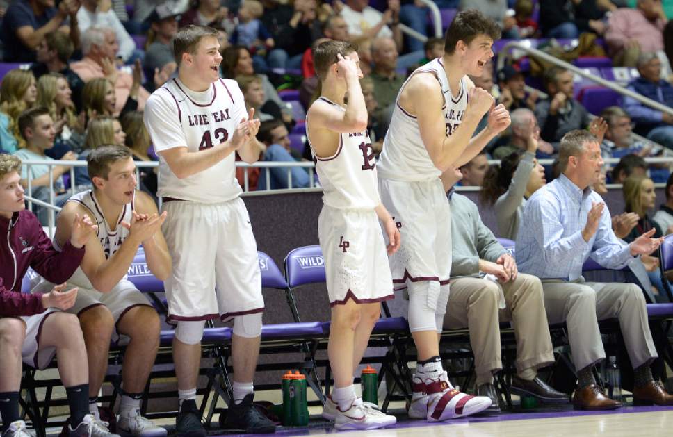 Leah Hogsten  |  The Salt Lake Tribune
Lone Peak's bench celebrates play. Lone Peak High School leads Copper Hills High School 32-26 during their 5A State boys' basketball semifinal playoff game at Weber State University's Dee Events Center, Friday, March 3, 2017.