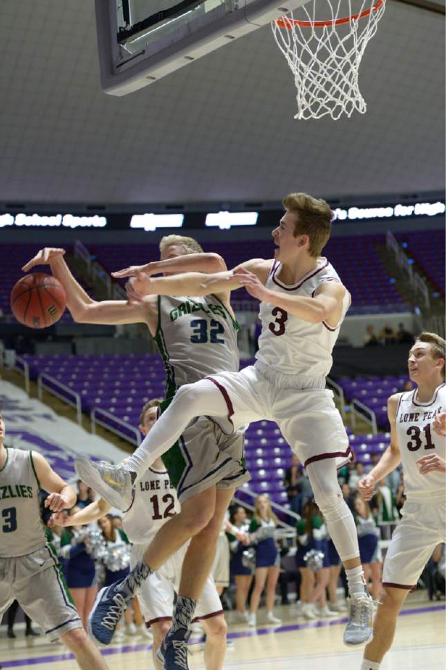 Leah Hogsten  |  The Salt Lake Tribune
Lone Peak's Steven Ashworth blocks Copper Hills' Sam Lyon under the net. Lone Peak High School leads Copper Hills High School 32-26 during their 5A State boys' basketball semifinal playoff game at Weber State University's Dee Events Center, Friday, March 3, 2017.