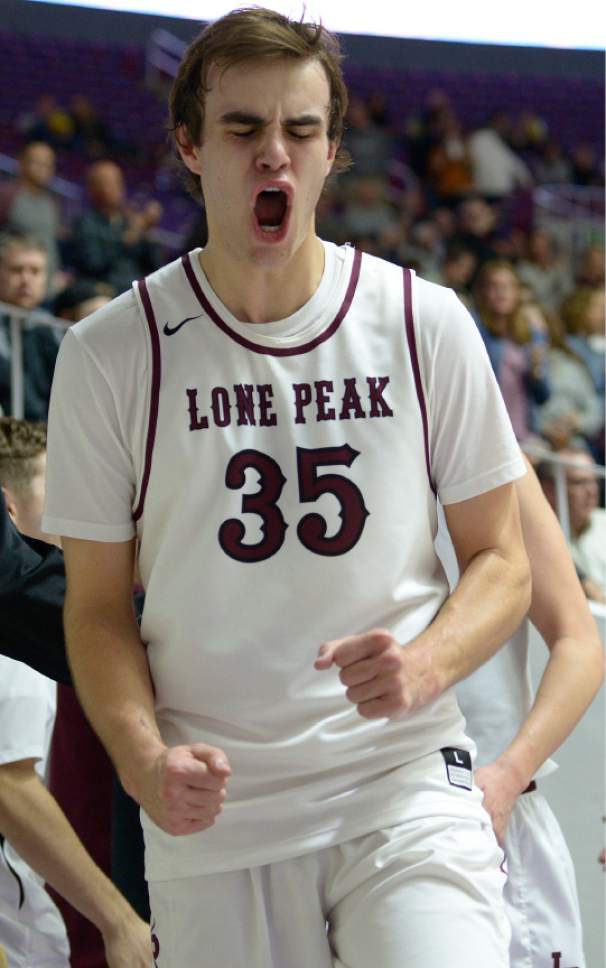Leah Hogsten  |  The Salt Lake Tribune
Lone Peak's Nathan Harkness, who had 21 points and 6 rebounds, celebrates the win with teammates. Lone Peak High School defeated Copper Hills High School 88-73 during their 5A State boysí basketball semifinal playoff game at Weber State University's Dee Events Center, Friday, March 3, 2017.