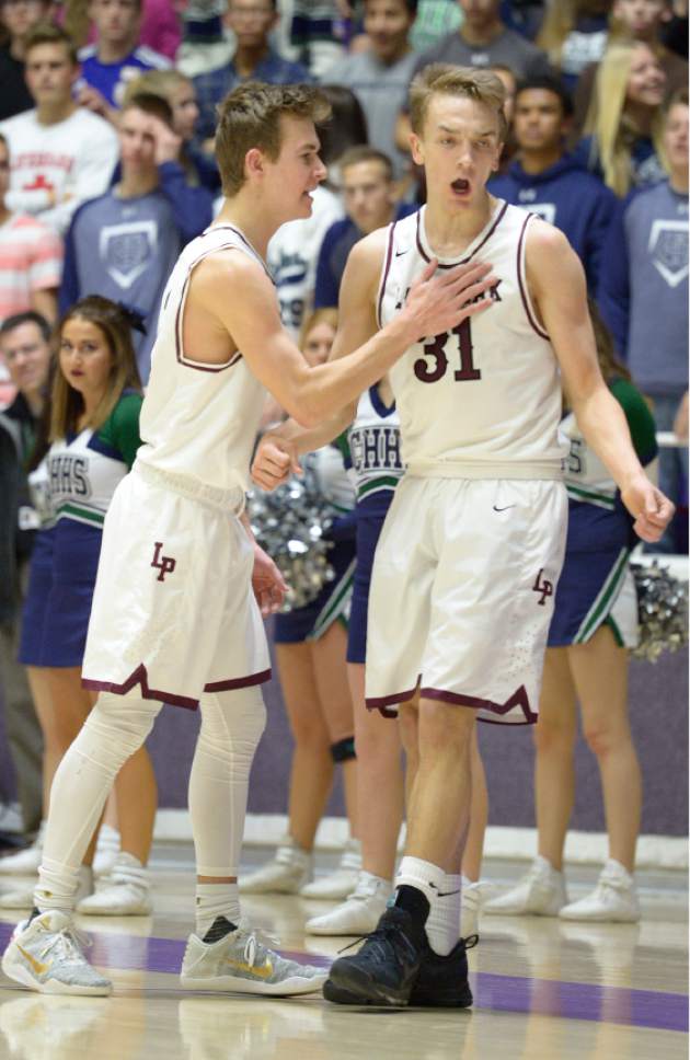 Leah Hogsten  |  The Salt Lake Tribune
Lone Peak's Steven Ashworth (3) celebrates teammate Lone Peak's Max McGrath (31). Lone Peak High School defeated Copper Hills High School 88-73 during their 5A State boys' basketball semifinal playoff game at Weber State University's Dee Events Center, Friday, March 3, 2017.