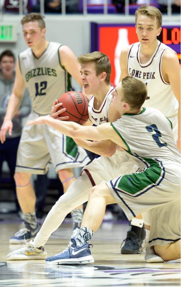 Leah Hogsten  |  The Salt Lake Tribune
Lone Peak's Steven Ashworth (3) is fouled by Copper Hills guard Callahan Blackham (2). Lone Peak High School leads Copper Hills High School 32-26 during their 5A State boys' basketball semifinal playoff game at Weber State University's Dee Events Center, Friday, March 3, 2017.
