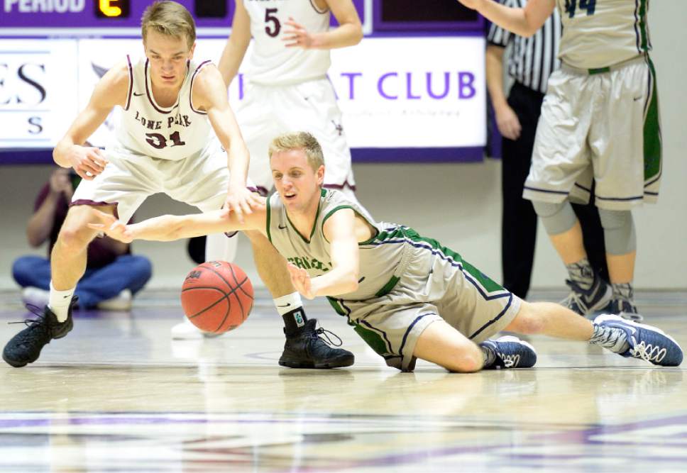 Leah Hogsten  |  The Salt Lake Tribune
Lone Peak's Max McGrath (31) and Copper Hills Sam Lyon (32) hit the deck for a loose ball. Lone Peak High School leads Copper Hills High School 32-26 during their 5A State boys' basketball semifinal playoff game at Weber State University's Dee Events Center, Friday, March 3, 2017.
