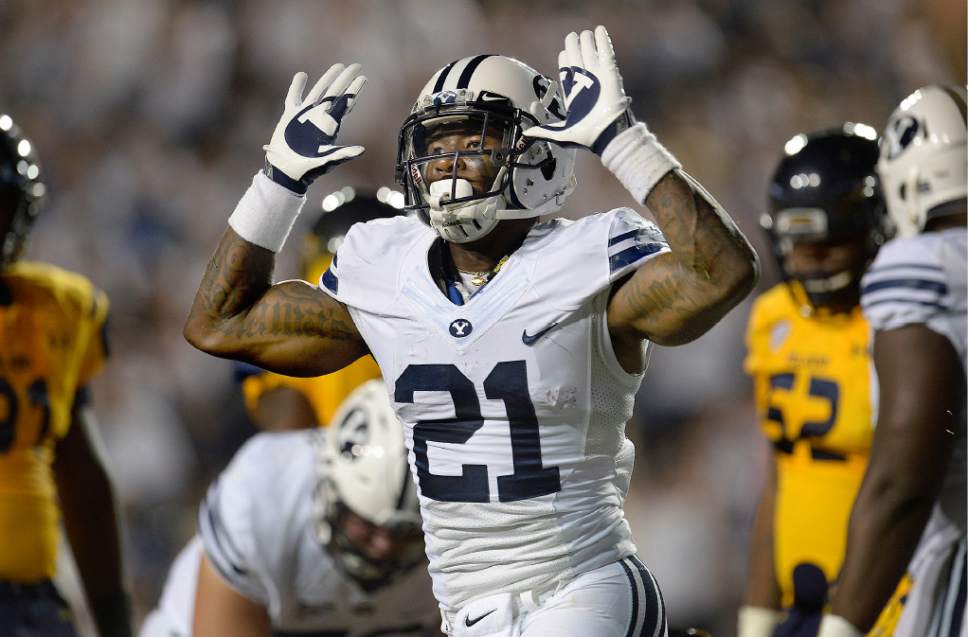 FILE - In this Sept. 30, 2016, file photo, BYU running back Jamaal Williams celebrates after scoring a touchdown against Toledo late in the first quarter of an NCAA college football game, in Provo, Utah. No. 14 Boise State hosts BYU on Thursday, Oct. 20, 2016. (Scott Sommerdorf/The Salt Lake Tribune via AP, File)