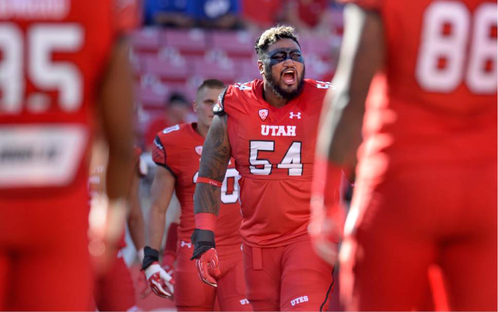 Scott Sommerdorf   |  The Salt Lake Tribune  
Utah OL Isaac Asiata fires up the team after Utah players stretched prior to the kickoff against BYU, Saturday, September 10, 2016.