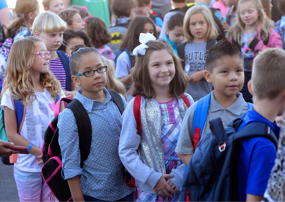 Al Hartmann  |  The Salt Lake Tribune
Students line up by classroom outside the brand new Butler Elementary in Cottonwood Heights Wednesday, Aug. 25.  It is one of hundreds of schools that opened Wednesday as students gear up for the 2016-2017 school year.