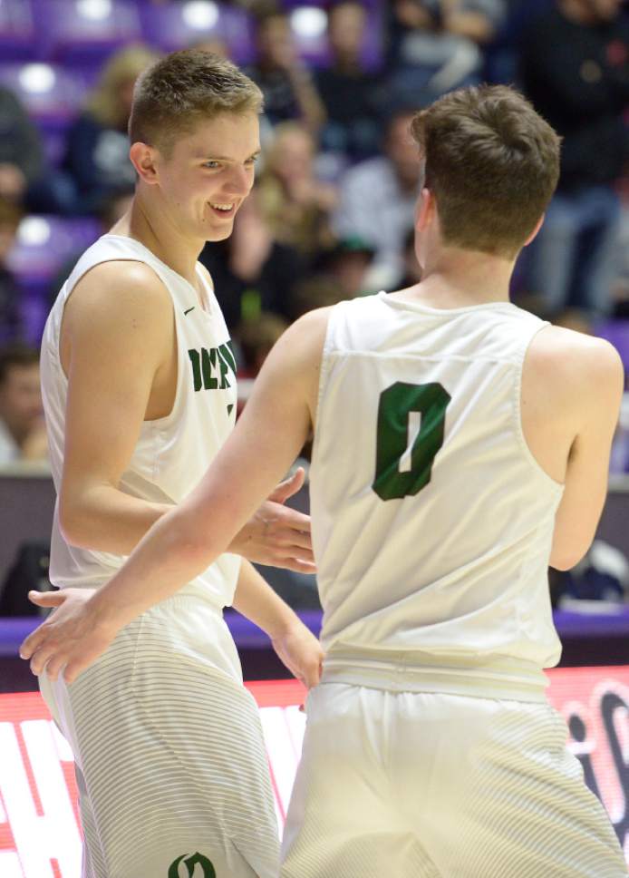Leah Hogsten  |  The Salt Lake Tribune
Olympus's Travis Wagstaff (1) is all smiles for Jeremy DowDell (0) as he heads to the free throw line in the remaining seconds of the game. Olympus High School defeated Corner Canyon High School 76-72 during their 4A State boysí basketball semifinal playoff game at Weber State University's Dee Events Center, Friday, March 3, 2017.