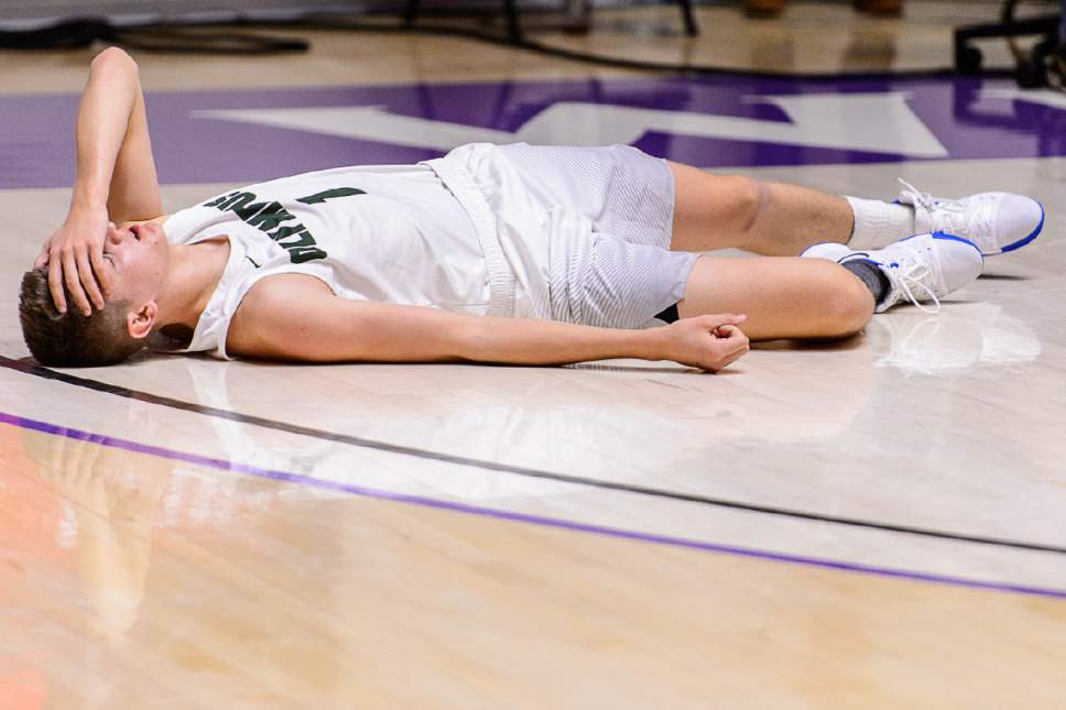 Trent Nelson  |  The Salt Lake Tribune
Olympus's Travis Wagstaff (1) on the floor as Springville defeats Olympus in overtime in the 4A state high school basketball championship game, Saturday March 4, 2017.