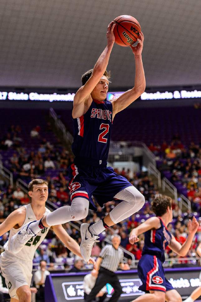 Trent Nelson  |  The Salt Lake Tribune
Springville's Seth Mortensen (2) leaps for a rebound as Springville faces Olympus in the 4A state high school basketball championship game, Saturday March 4, 2017.