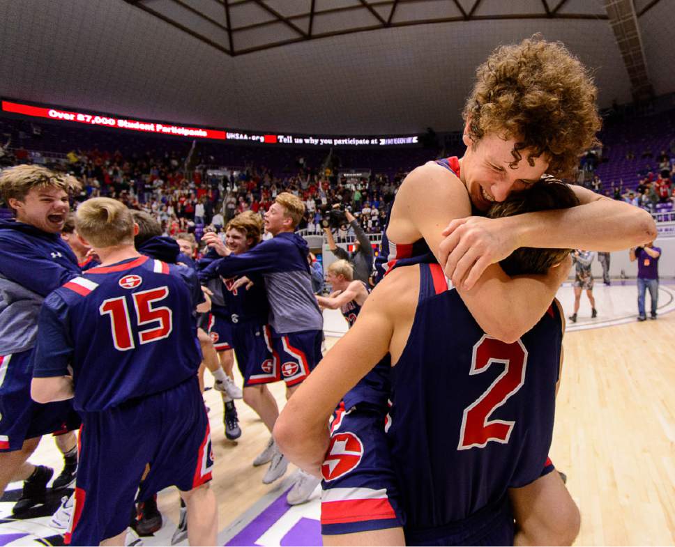 Trent Nelson  |  The Salt Lake Tribune
Springville's Bennett Hullinger (5) and Springville's Seth Mortensen (2) embrace as Springville defeats Olympus in overtime in the 4A state high school basketball championship game, Saturday March 4, 2017.
