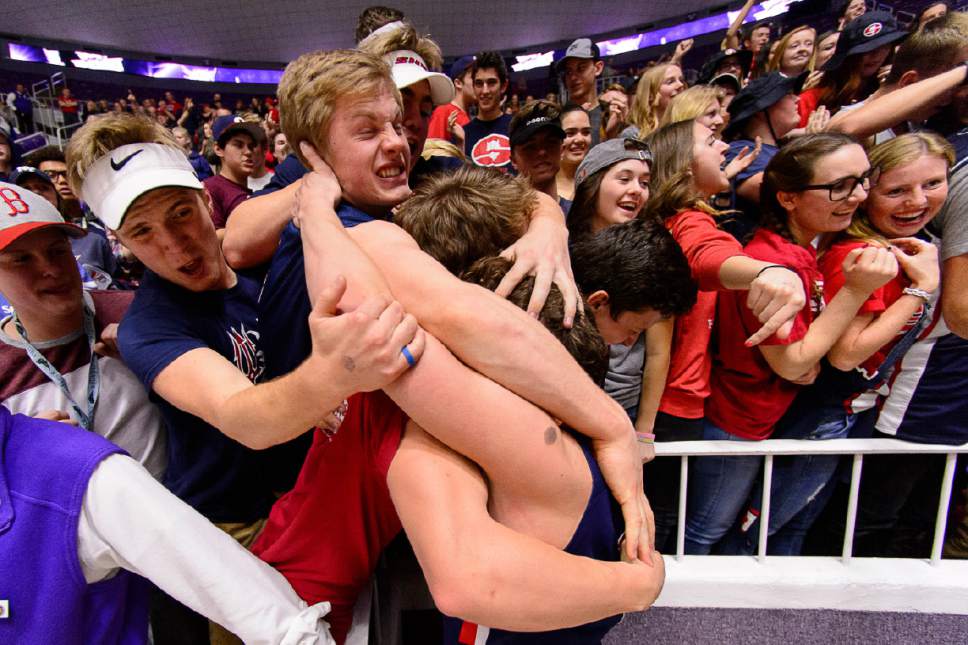 Trent Nelson  |  The Salt Lake Tribune
Springville players and fans celebrate their overtime win against Olympus in the 4A state high school basketball championship game, Saturday March 4, 2017.