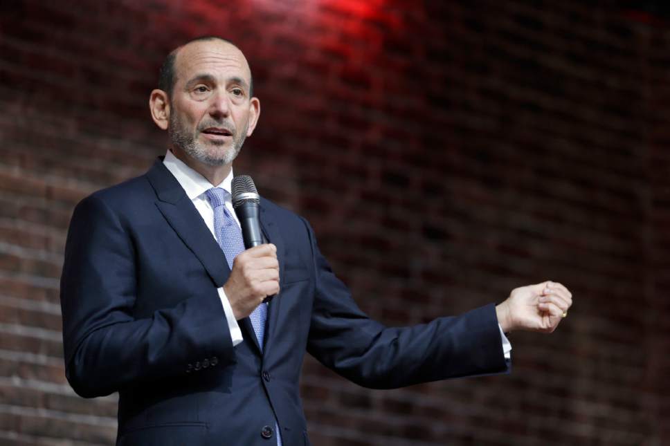 FILE - In this May 19, 2015, file photo, Major League Soccer commissioner Don Garber speaks to a gathering of fans in St. Louis. Garber believes his league is in transition when it comes to star players.  It's a youth movement slowly taking hold as teams shift from older designated players to younger options to fill the premier roles.  (AP Photo/Jeff Roberson, File)
