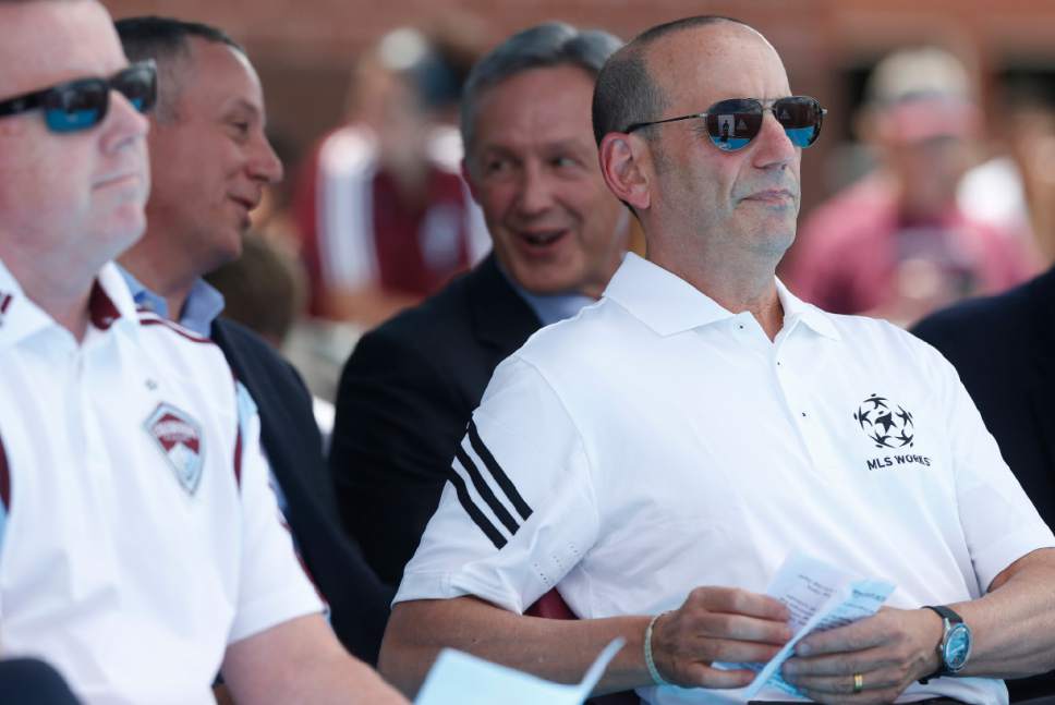 In this photograph taken Monday, July 27, 2015, Major League Soccer commissioner Don Garber, right, looks over his notes before speaking during a news conference for the league's All-Star game in Denver. The MLS all-star squad defeated the Tottenham Hotspur Wednesday night in Dick's Sporting Goods Park in the 20th annual mid-season classic for the league. (AP Photo/David Zalubowski)
