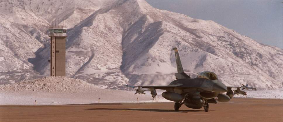 Tribune file photo
An F-16 taxing at Hill Air Force Base.  The Air Force has announced a restructuring of its civilian workforce, which state leaders say will mean the elimination of jobs at the northern Utah base.