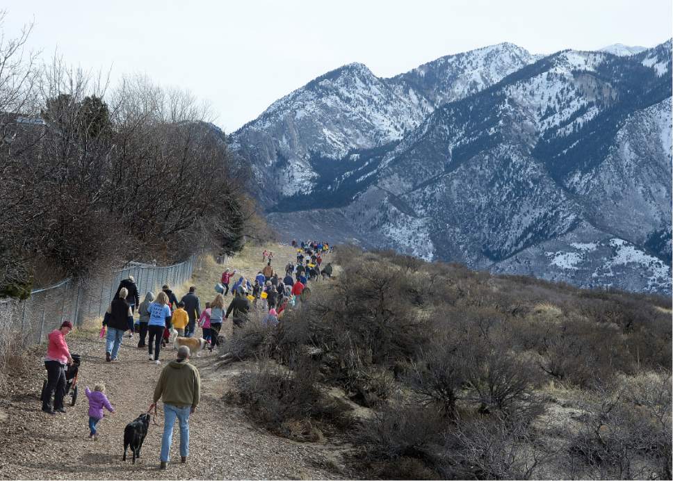 Scott Sommerdorf  |  The Salt Lake Tribune
Hikers walk during "March For The Park" on Saturday, an effort to work against a $4 Million 3-mile asphalt trail through Dimple Dell Regional Park in Sandy.