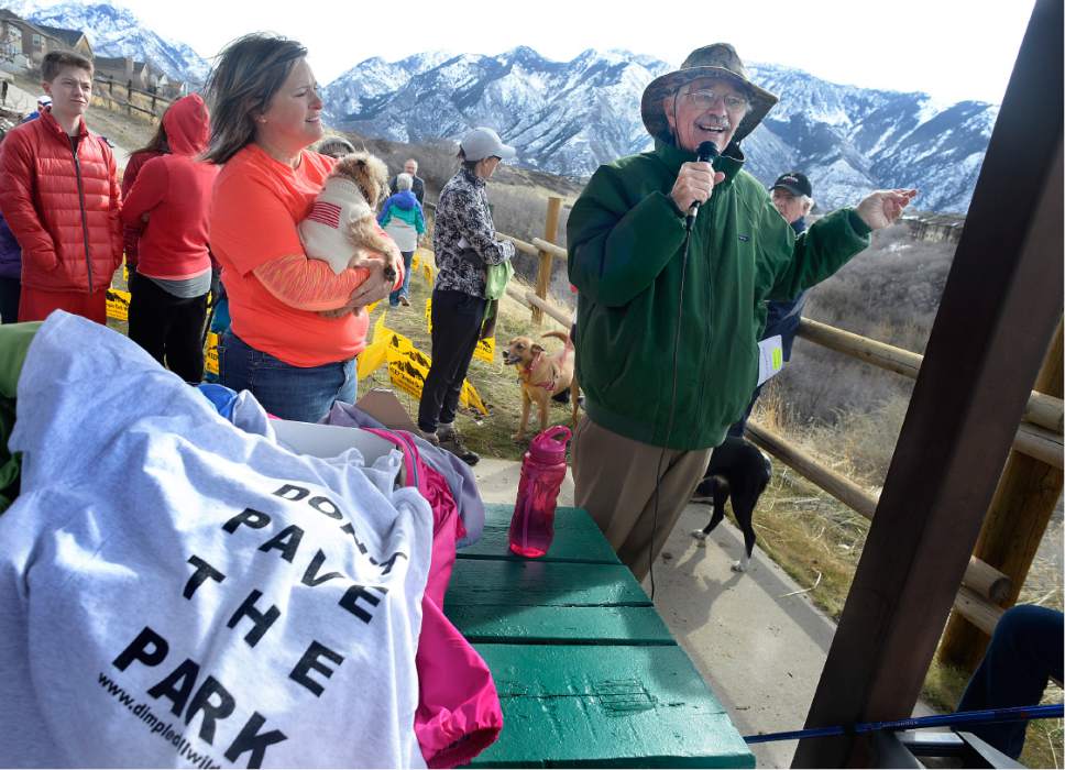 Scott Sommerdorf | The Salt Lake Tribune
Organizer Monica Zoltanski, left, listens as naturalist Ty Harrison speaks about the unique features of the Dimple Dell area. 
Hikers later walked during "March For The Park!" - an effort to work against a $4 Million 3-mile asphalt trail through Dimple Dell Regional Park in Sandy, Saturday, March 4, 2017. They are hiking east from the Wrangler Trailhead (10400 South 13000 East). The group had organized the event to support its petition effort and to inform park users of the unique characteristics found in Dimple Dell Park that it aims to preserve.