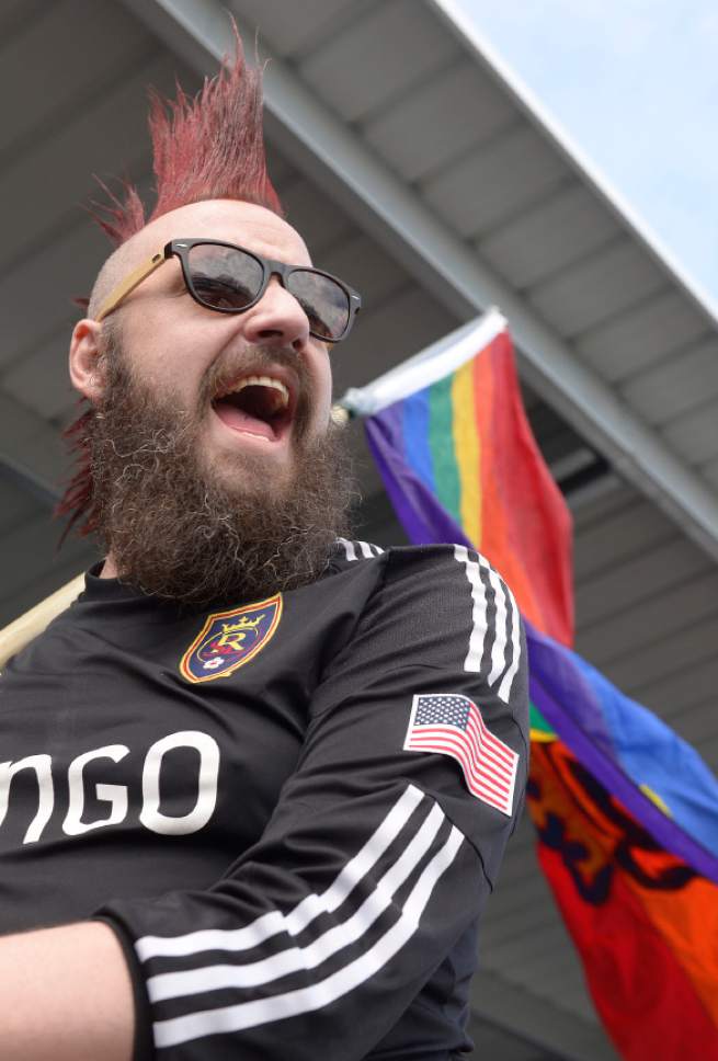 Leah Hogsten  |  The Salt Lake Tribune
Ryan Terry carries in his handmade rainbow Real Salt Lake flag into the stadium. Real Salt Lake kicked off the 2017 season Saturday, March 4, 2017 with a home opener against Toronto FC at Rio Tinto Stadium.