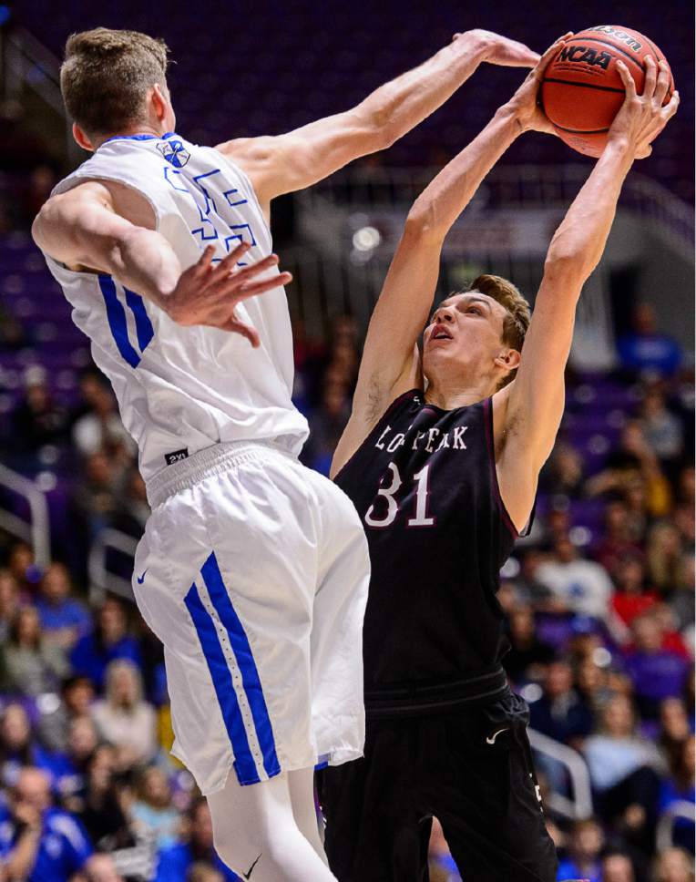 Trent Nelson  |  The Salt Lake Tribune
Lone Peak's Maxwell McGrath (31) shoots with Bingham's Branden Carlson (35) defending as Bingham faces Lone Peak in the 5A state high school basketball championship game, Saturday March 4, 2017.