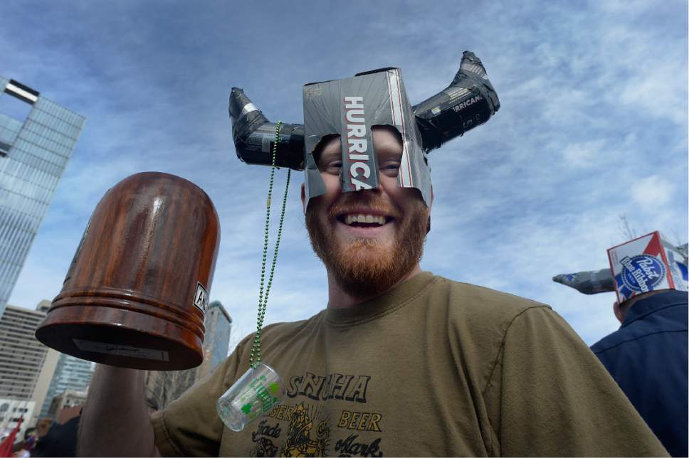 Scott Sommerdorf | The Salt Lake Tribune
Austin Davis hoists his drink prior to the 10th Annual Urban Chariot Pub Crawl, formerly known as Urban Iditarod, Saturday, March 4, 2017.