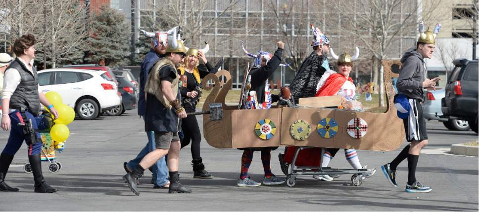 Scott Sommerdorf | The Salt Lake Tribune
Participants in the 10th Annual Urban Chariot Pub Crawl, formerly known as Urban Iditarod, head to Duffy's Bar, Saturday, March 4, 2017.