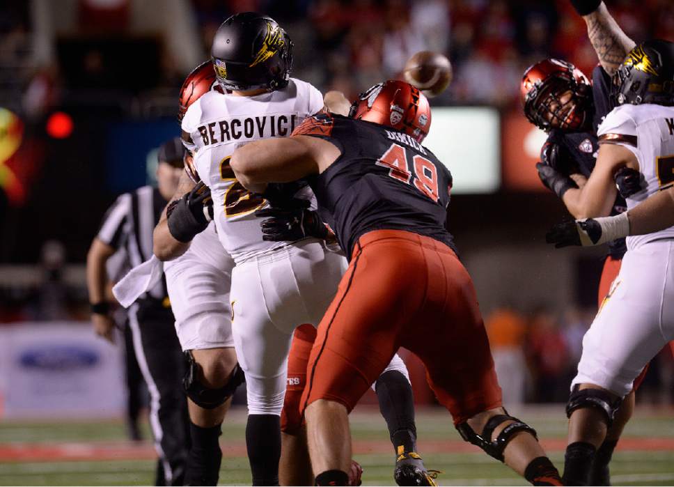 Scott Sommerdorf   |  The Salt Lake Tribune
The Utes thought they had a quick TD when Utah Utes DE Hunter Dimick (49) hit Arizona State Sun Devils QB Mike Bercovici (2), and caused a fumble that was returned by Utah Utes DE Pita Taumoepenu (50) for a TD. The play was reviewed and overturned as an incompletion. Utah led Arizona State 14-10 at the half, Saturday, October 17, 2015.