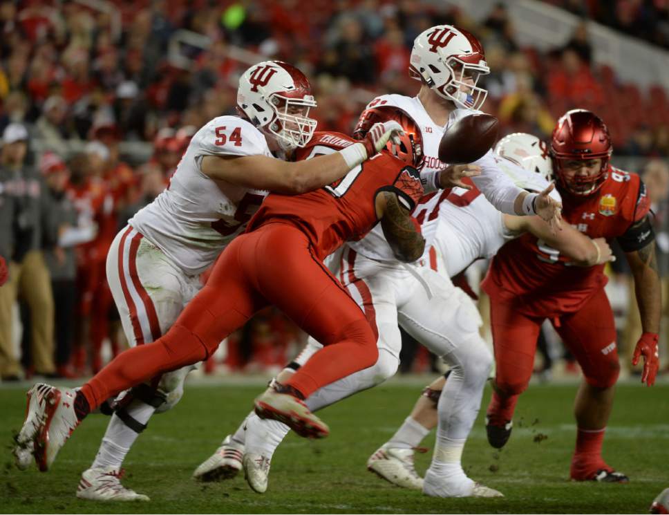 Steve Griffin / The Salt Lake Tribune

Utah Utes defensive end Pita Taumoepenu (50) strips the ball from Indiana Hoosiers quarterback Richard Lagow (21) during the Foster Farms Bowl at Levi's Stadium in Santa Clara California  Wednesday December 28, 2016. The ball was recovered by Utah Utes defensive end Hunter Dimick (49) on the play.