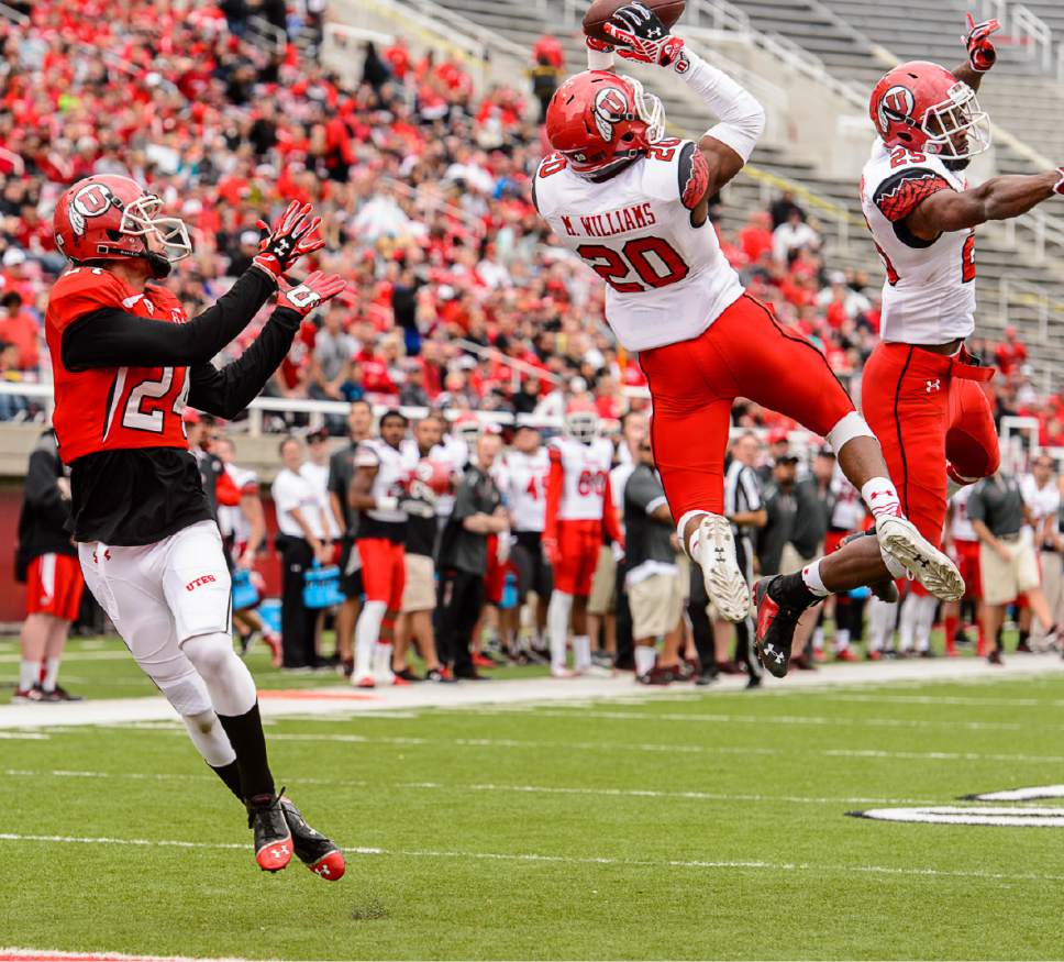 Trent Nelson  |  The Salt Lake Tribune
Marcus Williams (20) pulls in game ending touchdown interception at the Utah Football Red & White game in Salt Lake City, Saturday April 25, 2015.
