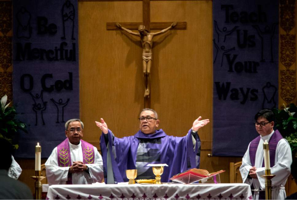 Steve Griffin  |  The Salt Lake Tribune


Father Gus Opalalic, a Pastor at the Roman Catholic Diocese of San Diego, celebrates Mass with members of the Utah Filipino Catholic Community during their 20th anniversary at the Our Lady of Lourdes Church in Salt Lake City Sunday March 5, 2017. Opalalic is in Salt Lake City for the installation of Bishop Oscar Solis as the 10th Bishop of the Diocese of Salt Lake City.
