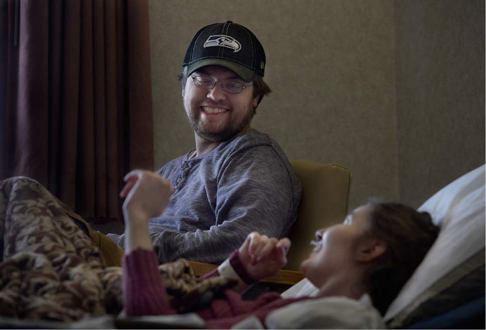 Scott Sommerdorf   |  The Salt Lake Tribune  
Ryan Comer visits with his wife, Shannon who has severe MS, Saturday, January 28, 2017. They have two young children, and he's coping with his wife's illness by covering preps because it brings him joy. Comer is a prep sports writer at the Ogden Standard-Examiner.