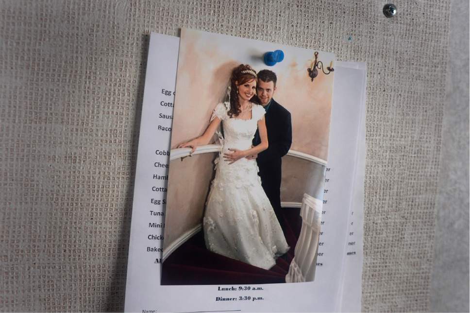 Scott Sommerdorf   |  The Salt Lake Tribune  
A wedding photo of Ryan Comer and his wife Shannon, hangs in her room at the South Ogden Post Acute care center, Saturday, January 28, 2017. They have two young children, and he's coping with his wife's illness by covering preps because it brings him joy. Comer is a prep sports writer at the Ogden Standard-Examiner.