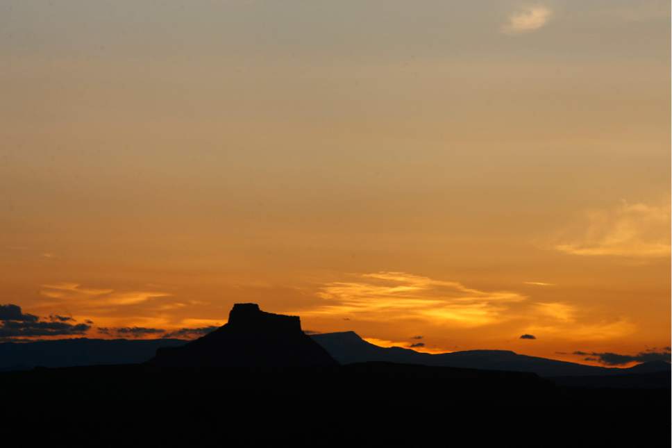 Rick Egan   |  The Salt Lake Tribune

The sun sets behind Factory Butte, near Hanksville, Utah, Wednesday, May 19, 2010.
