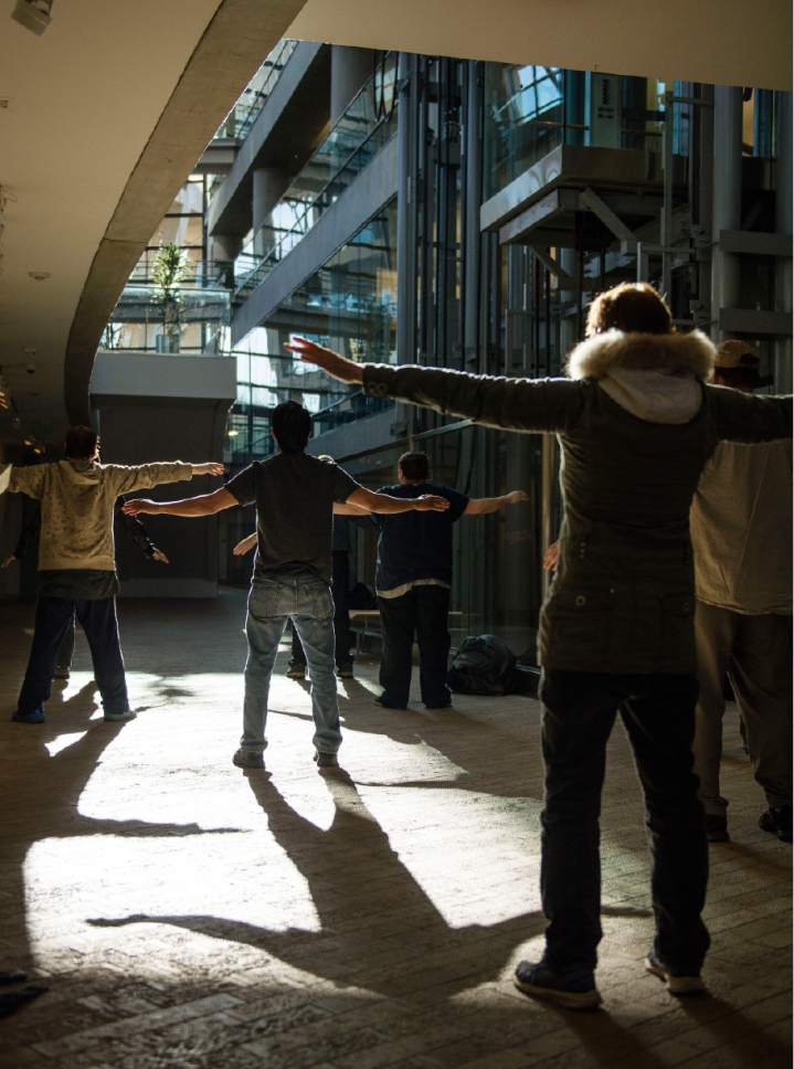 Lennie Mahler  |  The Salt Lake Tribune

A group of homeless people practice tai chi at the Salt Lake City Public Library, Thursday, March 2, 2017.