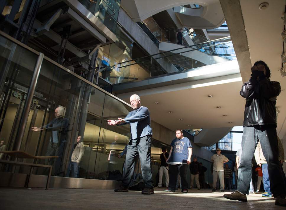 Lennie Mahler  |  The Salt Lake Tribune

Bernie Hart leads a group of homeless people in tai chi at the Salt Lake City Public Library, Thursday, March 2, 2017.