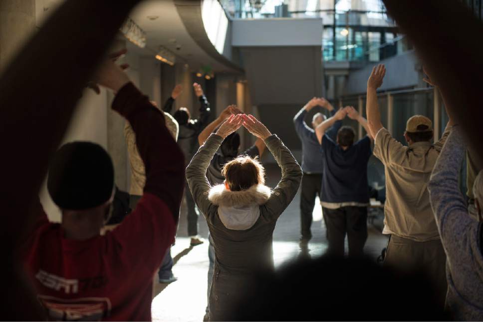 Lennie Mahler  |  The Salt Lake Tribune

A group of homeless people practice tai chi at the Salt Lake City Public Library, Thursday, March 2, 2017.